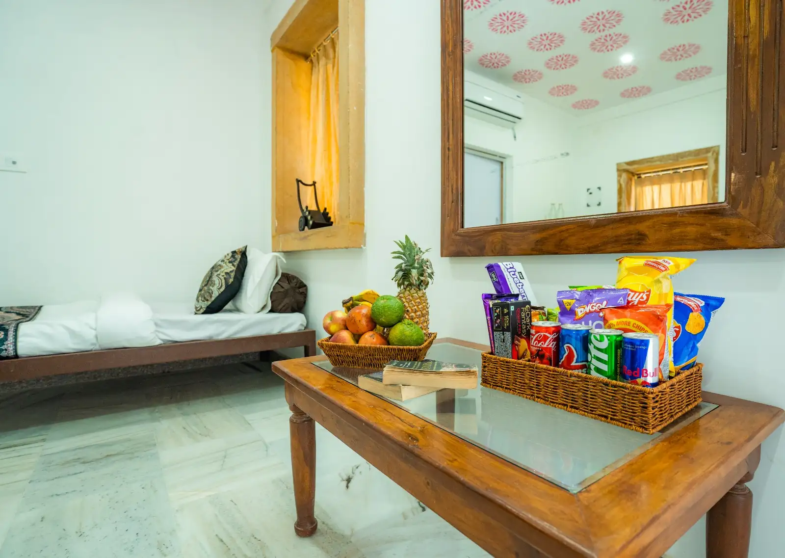Heritage AC Room seating area with welcome fruit basket