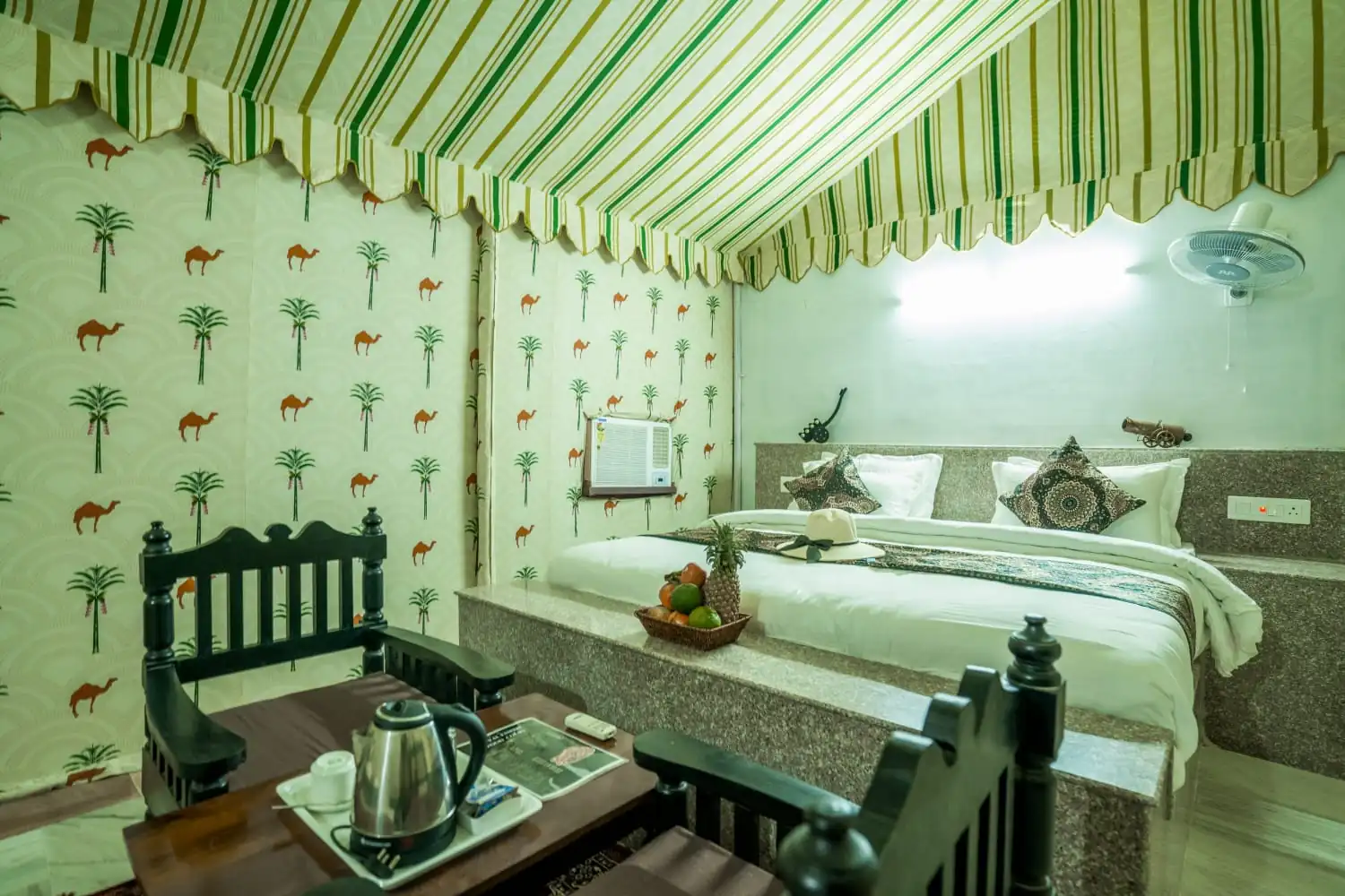 Maharaja Luxury AC Tent bed with camel-print Rajasthani decor