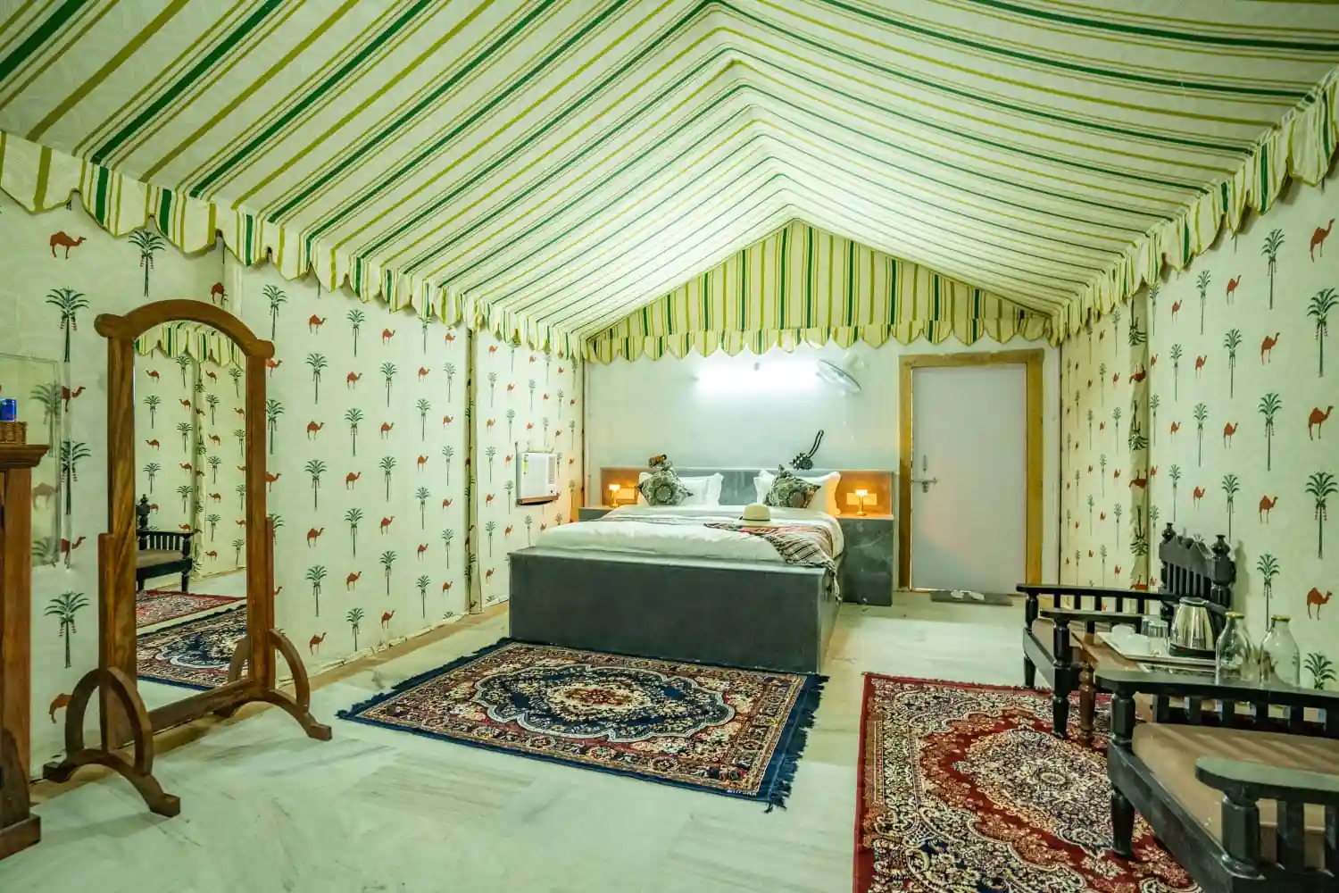 Interior of the Maharaja Luxury AC Tent with camel-print Rajasthani decor