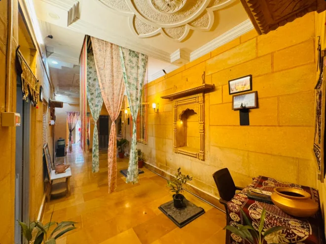 Hotel corridor with sandstone walls and traditional Rajasthani decor
